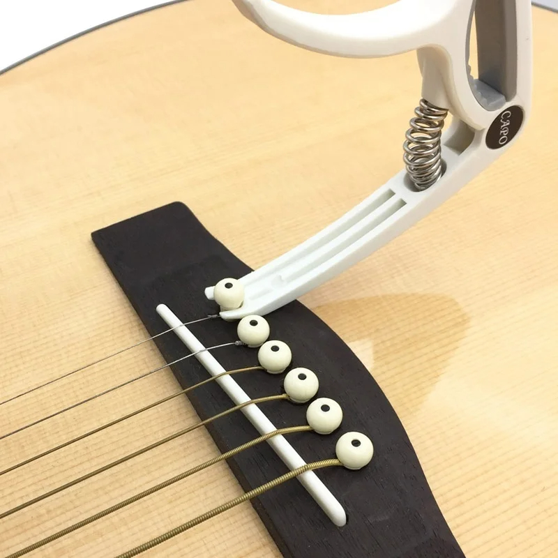 Capo gitar plastik 6 dawai ele - Musical Instrument Names ulasan dan harga